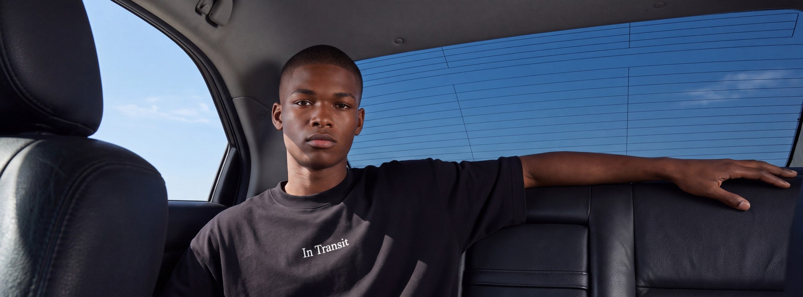 In Transit oversized tee, in the back seat of a car
