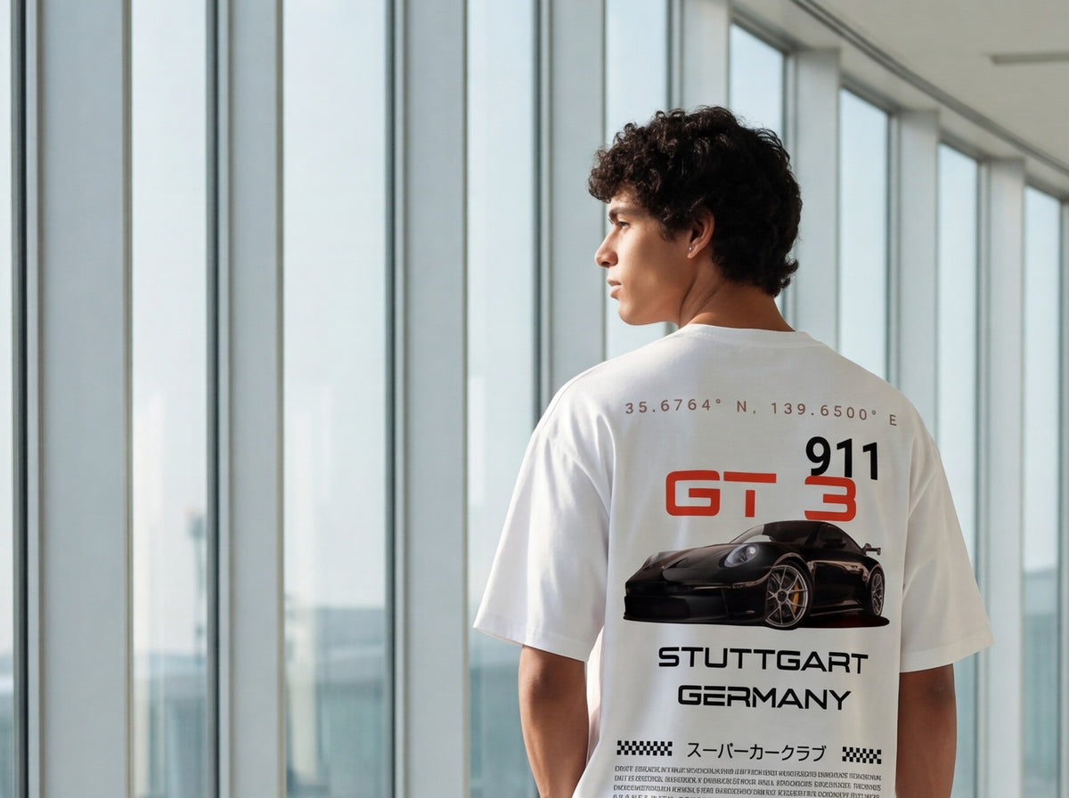 Model from behind in the white GT3 Stuttgart oversized tee, airport walkway